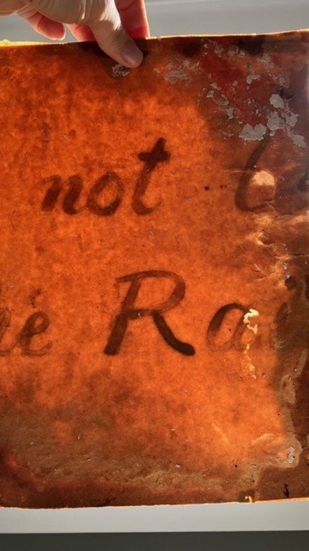 A hidden message on the backing paper from a watercolour from the A la Ronde Shell Gallery